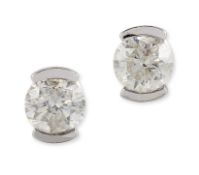 A PAIR OF 9CT WHITE GOLD SOLITAIRE DIAMOND EARRINGS