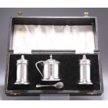 A GEORGE VI SILVER THREE-PIECE CRUET SET