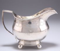 A PROVINCIAL GEORGE III SILVER CREAM JUG