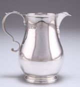 A GEORGE V SILVER CREAM JUG