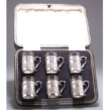 A SET OF SIX GEORGE V SILVER TOT CUPS