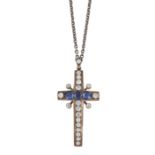 A CUBIC ZIRCONIA AND SYNTHETIC SAPPHIRE CROSS PENDANT ON CHAIN