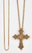 A 9CT GOLD CROSS PENDANT ON CHAIN