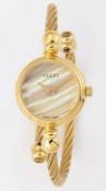 A LADY'S GOLD PLATED GUCCI BANGLE WATCH