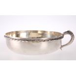 A CIRCULAR SILVER-PLATED BOWL WITH SINGLE FISH HANDLE