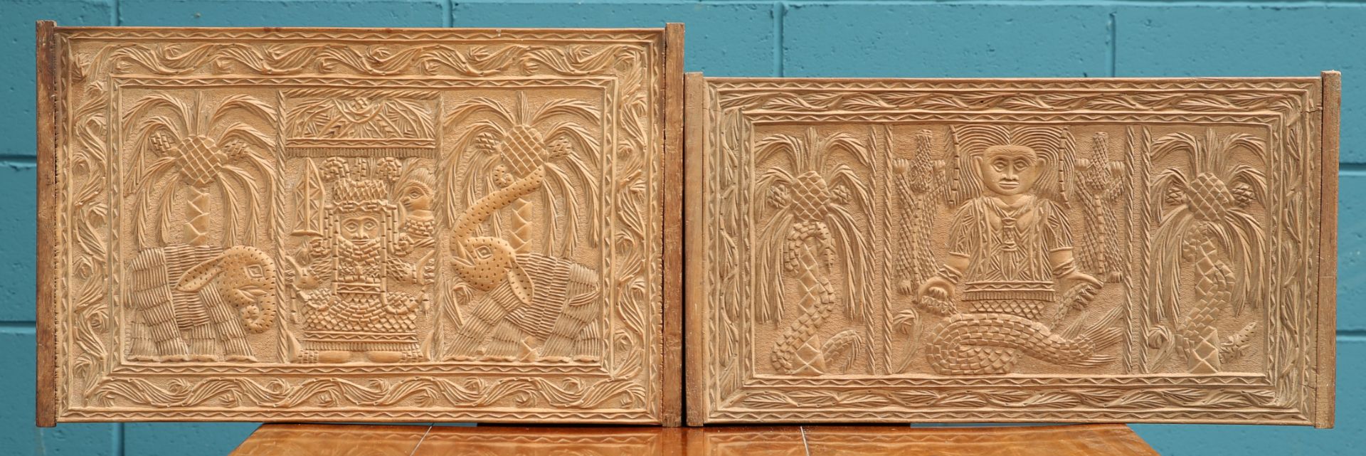 TWO CARVED WOODEN PANELS