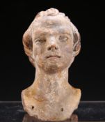 A TERRACOTTA HEAD OF A MAN