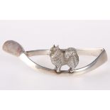 A SILVER NAPKIN CAST WITH ANIMAL