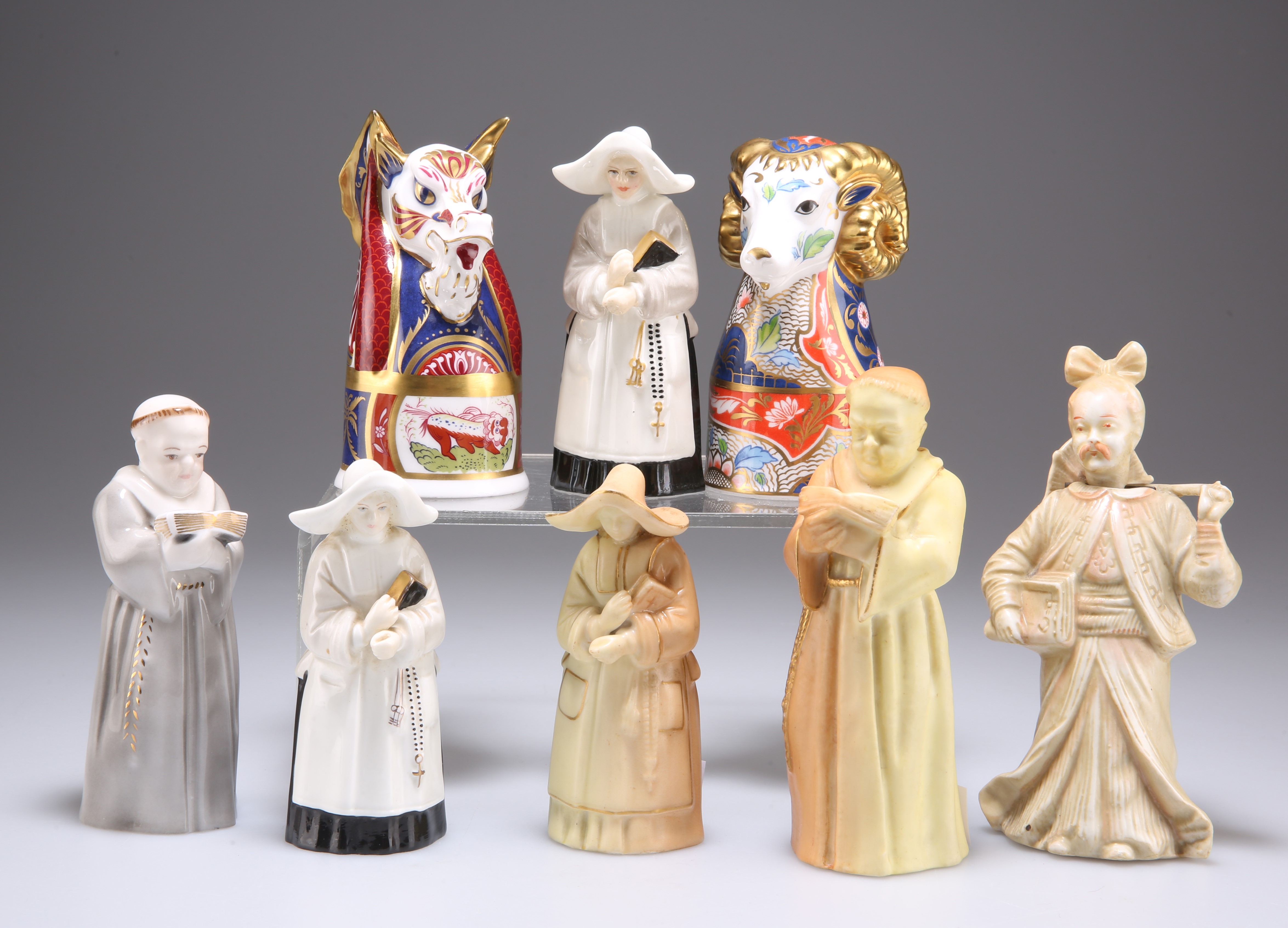 A GROUP OF PORCELAIN CANDLESNUFFERS