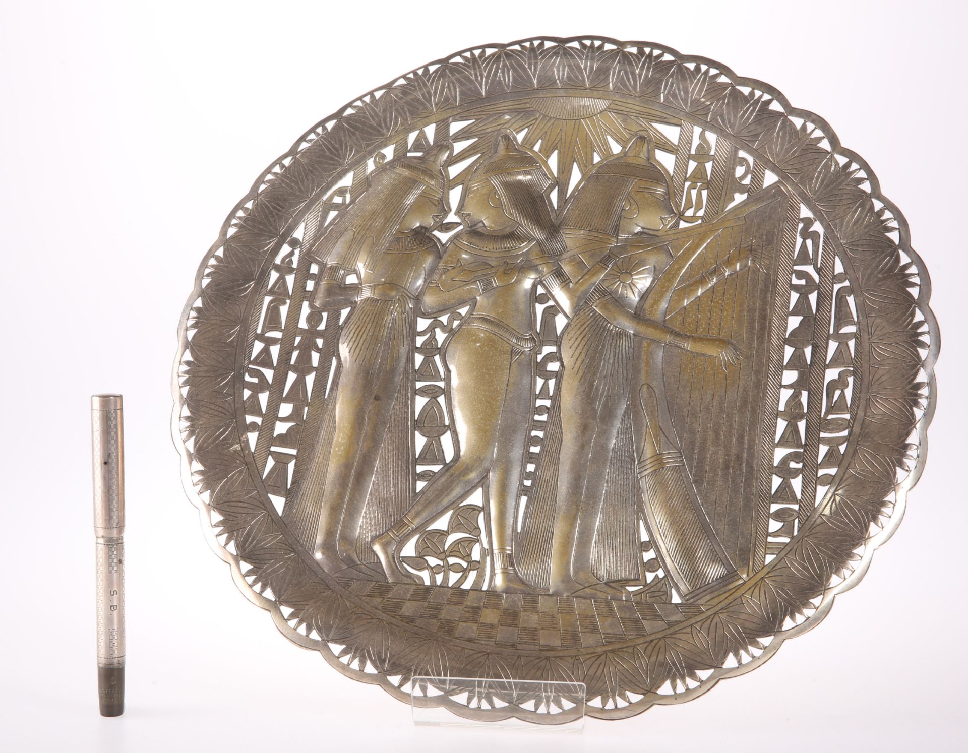 A SILVER-PLATE PIERCED EGYPTIAN PLAQUE