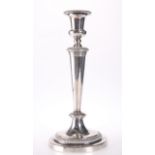 A SILVER PLATED CANDLESTICK OF TAPERING FORM WITH CIRCULAR BASE