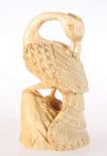 A CARVED IVORY FIGURE OF A PEACOCK