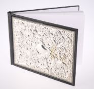 A CARRS SILVER MOUNTED EMBOSSED NOTEBOOK