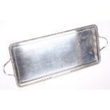 A SILVER-PLATED RECTANGULAR TWO HANDLED TRAY