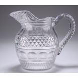 AN EARLY 19TH CENTURY CUT-GLASS WATER JUG