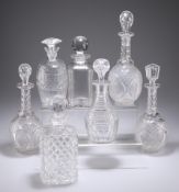 SEVEN VARIOUS CUT GLASS DECANTERS