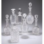 SEVEN VARIOUS CUT GLASS DECANTERS