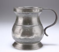 A PEWTER HALF PINT TANKARD