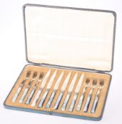 A CASED SET OF SIX SILVER PLATED FRUIT KNIVES AND FORKS