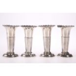 A SET OF FOUR PART FLUTED POSY VASES