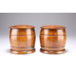 A PAIR OF CIRCA 1950 OAK TOBACCO JARS