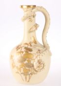 A ROYAL WORCESTER IVORY PORCELAIN DRAGON EWER