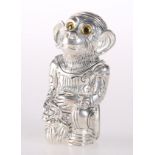 A SILVER-PLATED PIN CUSHION IN THE FORM OF A MONKEY