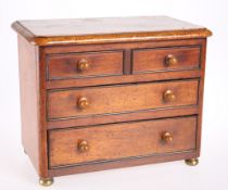 A 19TH CENTURY MINIATURE CHEST OF THREE DRAWERS