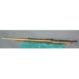 A SNOOKER CUE AND A FISHING ROD