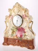 A VICTORIAN STAFFORDSHIRE POTTERY MANTEL CLOCK