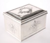 A SILVER METAL CASKET