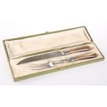 A BOXED SET OF CARVING KNIFE & FORK WITH HORN HANDLES
