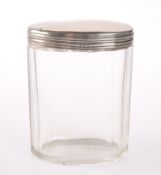 A SILVER MOUNTED GLASS JAR