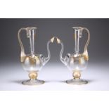 A PAIR OF GILDED EWERS