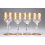 A SET OF FOUR GILDED WINE GLASSES