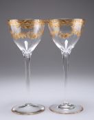 A PAIR OF CONTINENTAL GILDED WINE GLASSES, CIRCA 1895