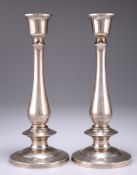 A PAIR OF THAI SILVER CANDLESTICKS