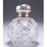 AN EDWARDIAN SILVER-TOPPED CUT-GLASS SCENT BOTTLE