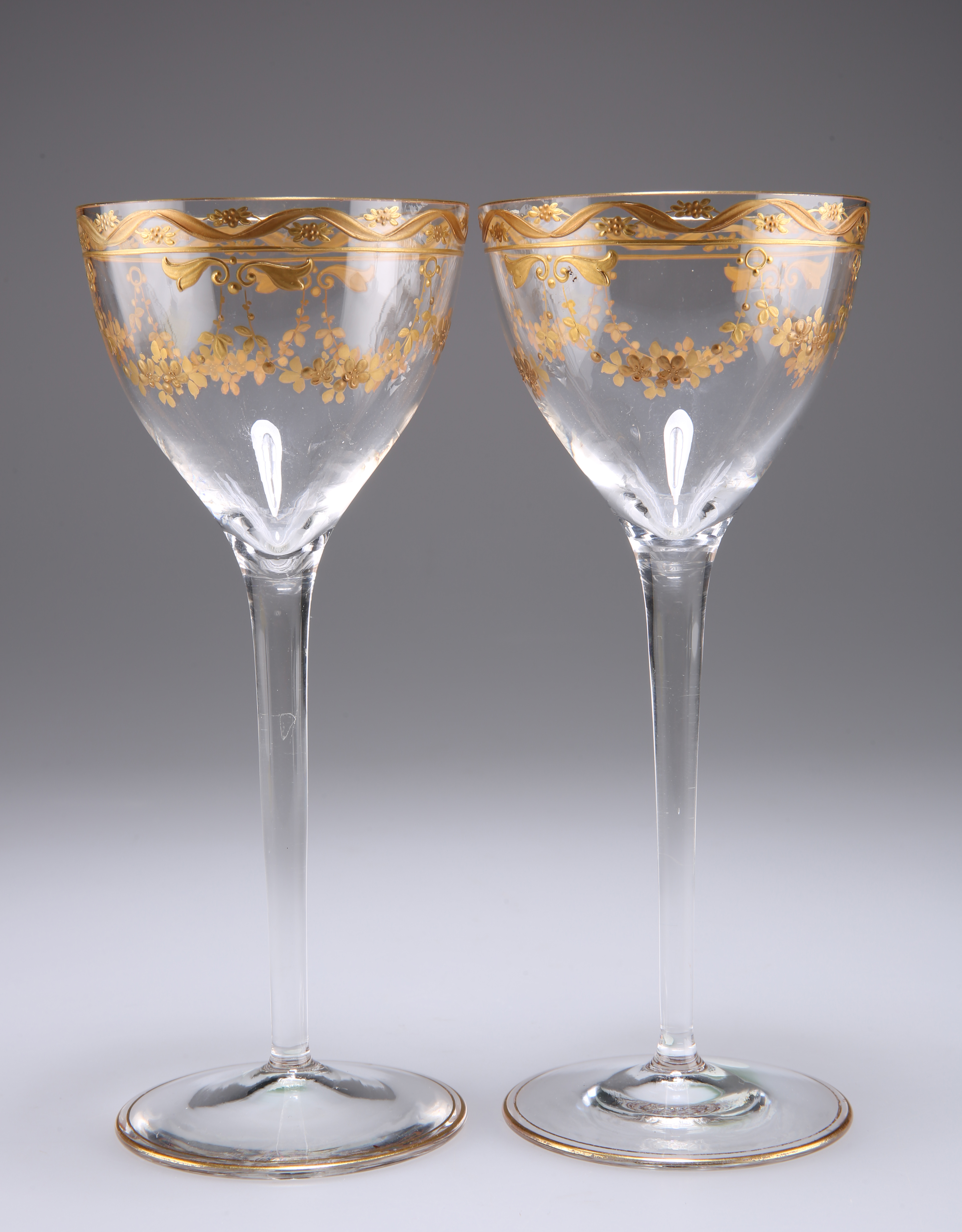A PAIR OF CONTINENTAL GILDED WINE GLASSES, CIRCA 1895