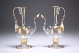 A PAIR OF GILDED EWERS