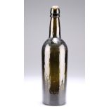 A PLANISHED GREEN GLASS WINE BOTTLE