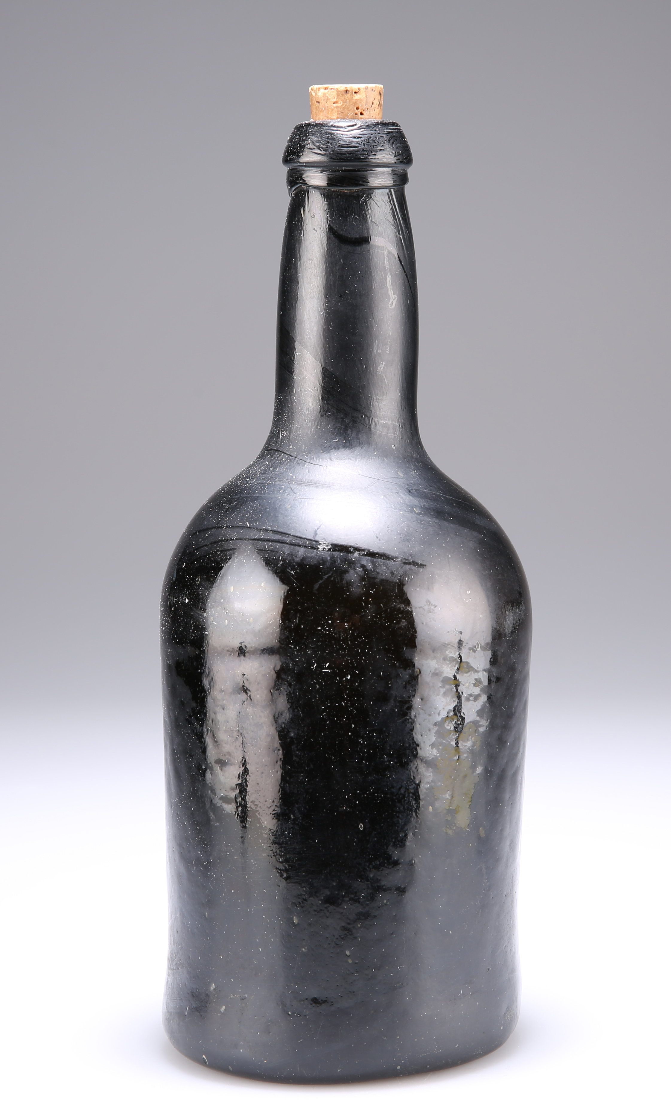 A BROWN GLASS BOTTLE