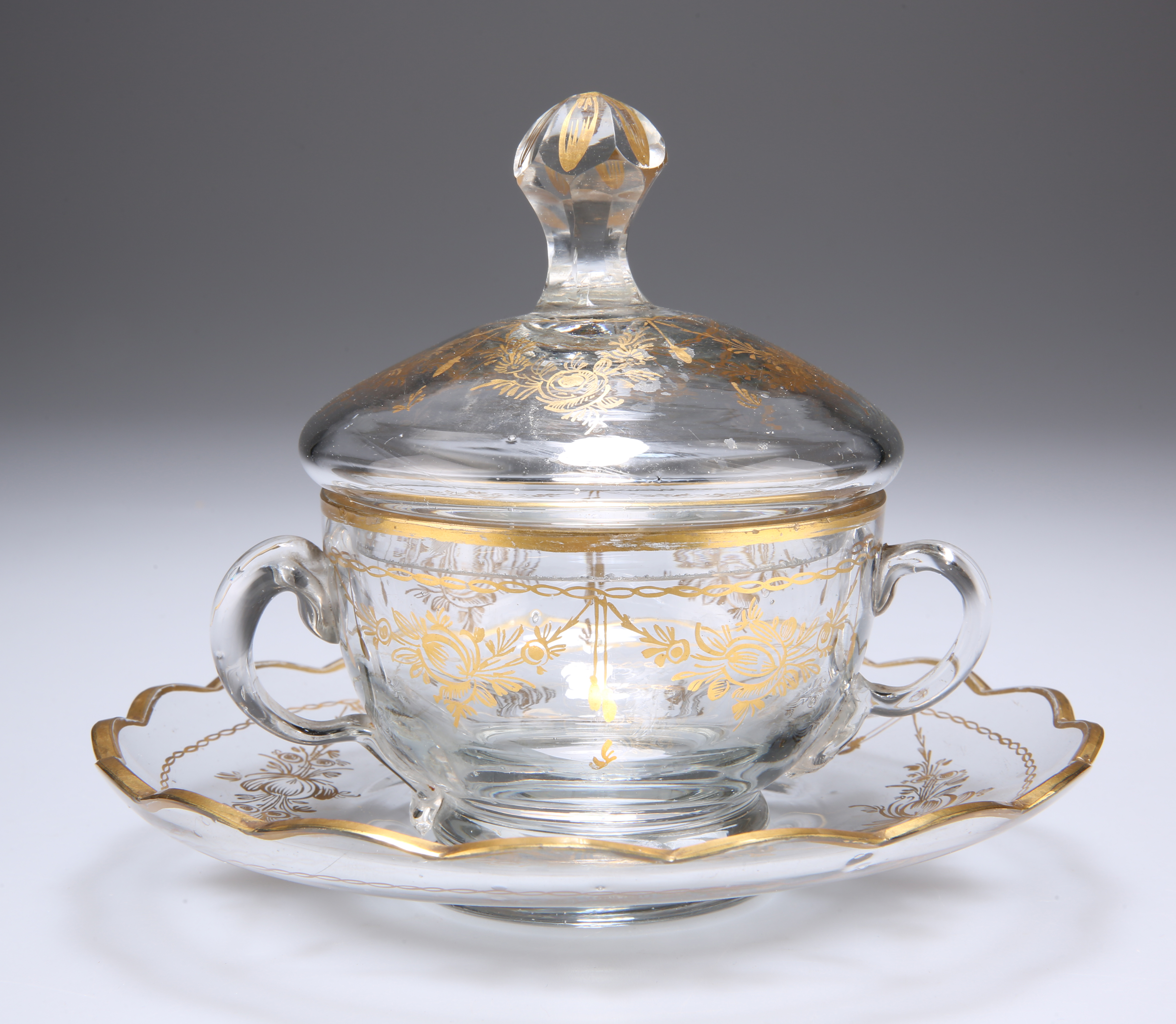 A GILDED CUP, COVER AND SAUCER