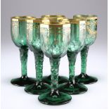 A RARE SET OF SIX BOHEMIAN GREEN AND GILDED WINE GLASSES, CIRCA 1790