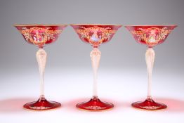 A SET OF THREE VENETIAN RUBY GLASS CHAMPAGNE COUPES