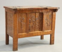 AN UNUSUAL ARTS AND CRAFTS OAK 'HUNTING' CABINET