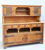AN ARTS AND CRAFTS OAK SIDEBOARD, IN THE MANNER OF LIBERTY & CO