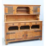 AN ARTS AND CRAFTS OAK SIDEBOARD, IN THE MANNER OF LIBERTY & CO