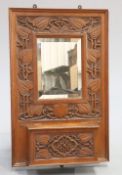 GIGGLESWICK SCHOOL AN ARTS AND CRAFTS CARVED OAK HALL MIRROR CIRCA 1905