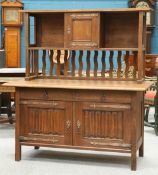 AN ARTS AND CRAFTS OAK SIDEBOARD